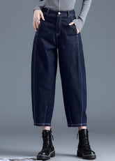 Pantalones harén de mezclilla de algodón con bolsillos y cintura alta en color azul liso